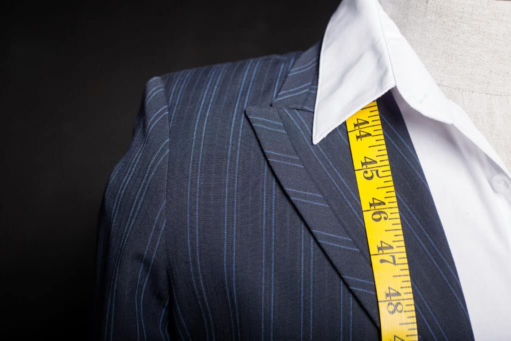 suit with measuring tape for tailoring